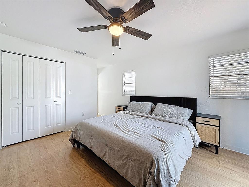 1652 Larkin Road Spring Hill, FL 34608 - Photo 13 of 29 a bedroom with a bed and a ceiling fan