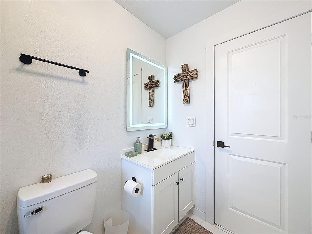 1652 Larkin Road Spring Hill, FL 34608 - Photo 19 of 29 a bathroom with a sink toilet and shower