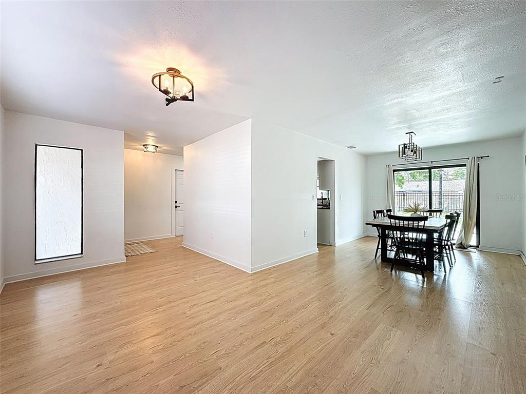 1652 Larkin Road Spring Hill, FL 34608 - Photo 23 of 29 a view of a dining room with furniture window and wooden floor