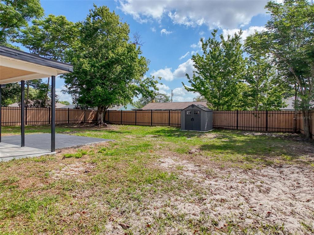 1652 Larkin Road Spring Hill, FL 34608 - Photo 26 of 29 a view of a house with backyard and tree