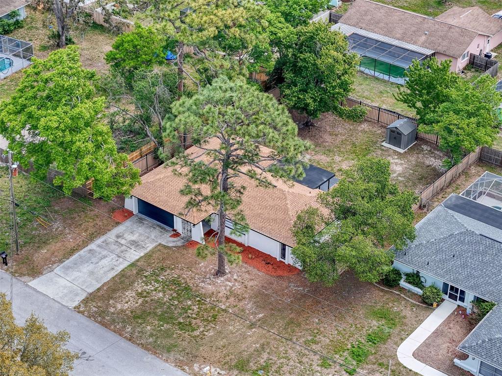 1652 Larkin Road Spring Hill, FL 34608 - Photo 29 of 29 an aerial view of a house with a yard basket ball court and outdoor seating