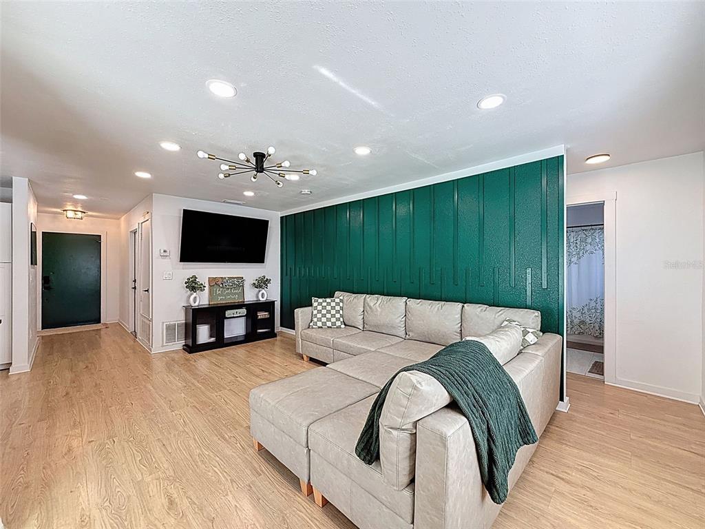 1652 Larkin Road Spring Hill, FL 34608 - Photo 8 of 29 a living room with furniture and a flat screen tv