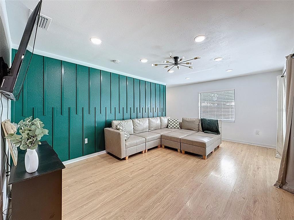 1652 Larkin Road Spring Hill, FL 34608 - Photo 10 of 29 a living room with furniture and wooden floor