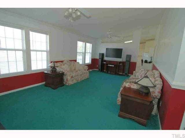 1003 Lexington Farm Road Apex, NC 27502 - Photo 3 of 12 Family room view from the foyer.