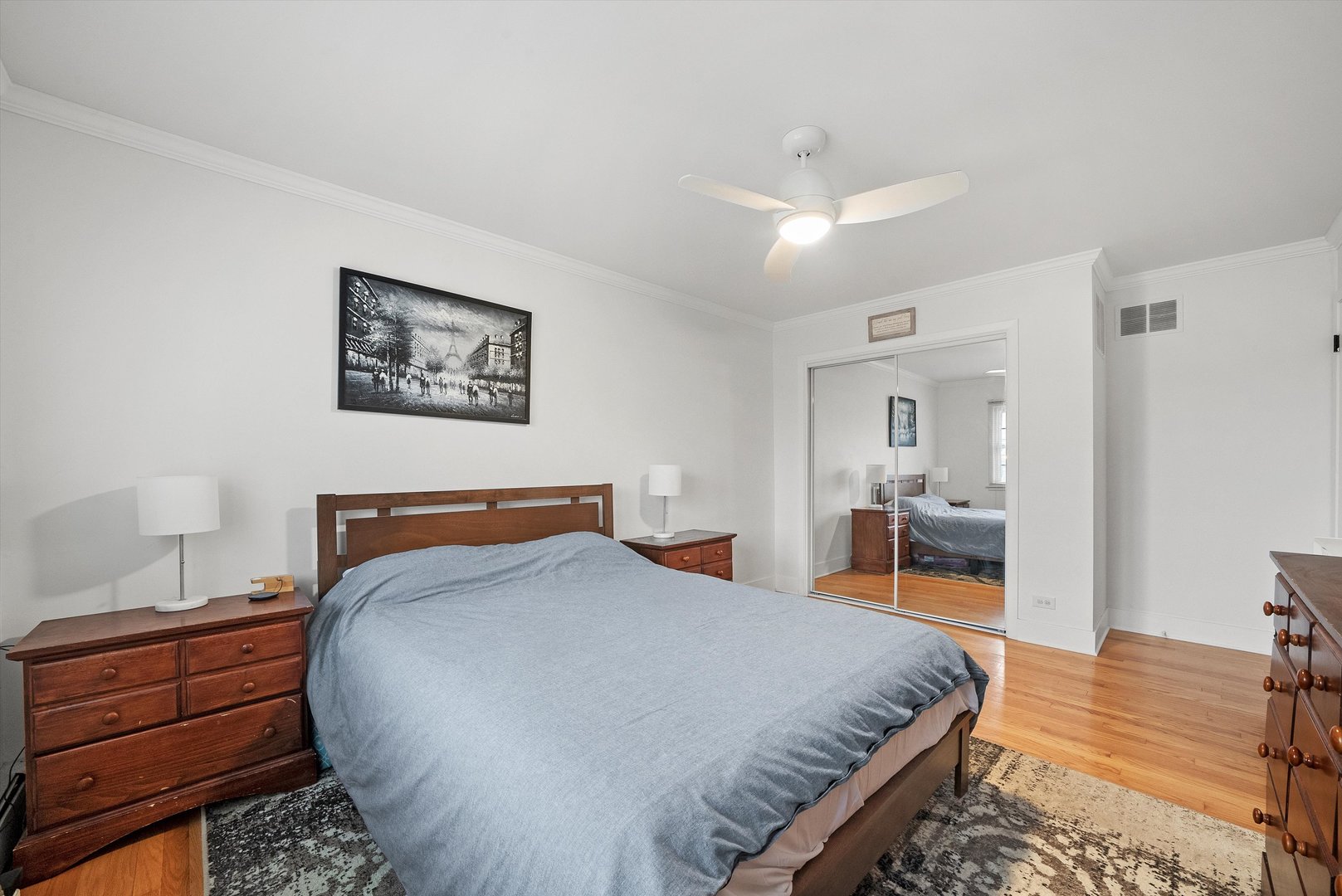 2920 Quentin Road Rolling Meadows, IL 60008 - Photo 16 of 30 a bedroom with a bed and a table