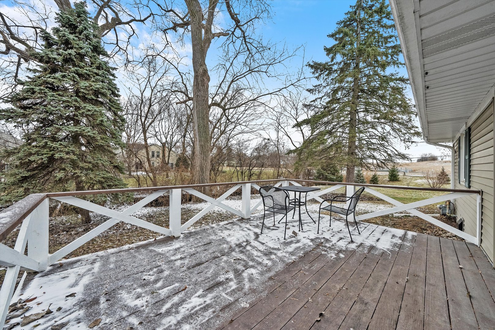 2920 Quentin Road Rolling Meadows, IL 60008 - Photo 22 of 30 a view of a roof deck with table and chairs with wooden floor and fence