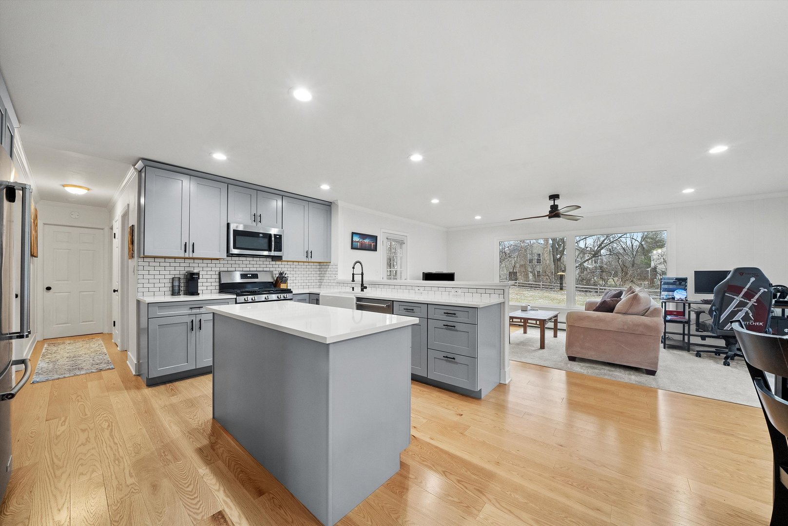 2920 Quentin Road Rolling Meadows, IL 60008 - Photo 9 of 30 a kitchen with white cabinets and stainless steel appliances