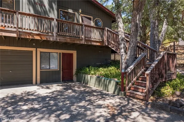 a view of a house with wooden stairs