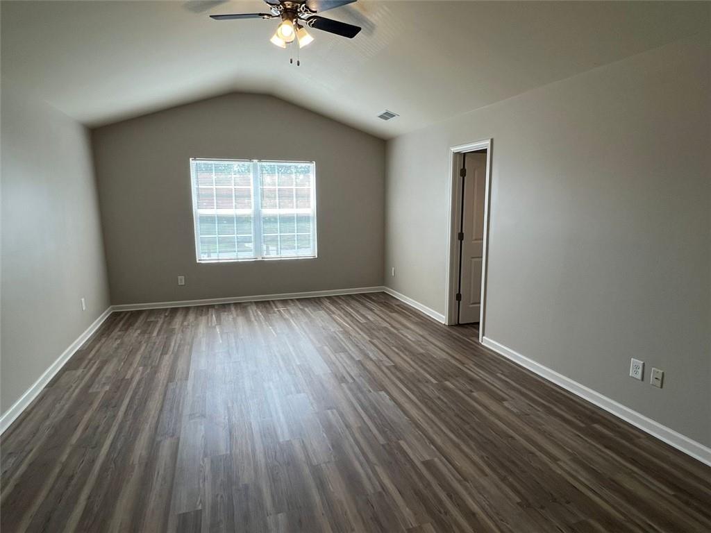 34 Luwanda Trail Cartersville, GA 30120 - Photo 16 of 30 an empty room with wooden floor fan and windows