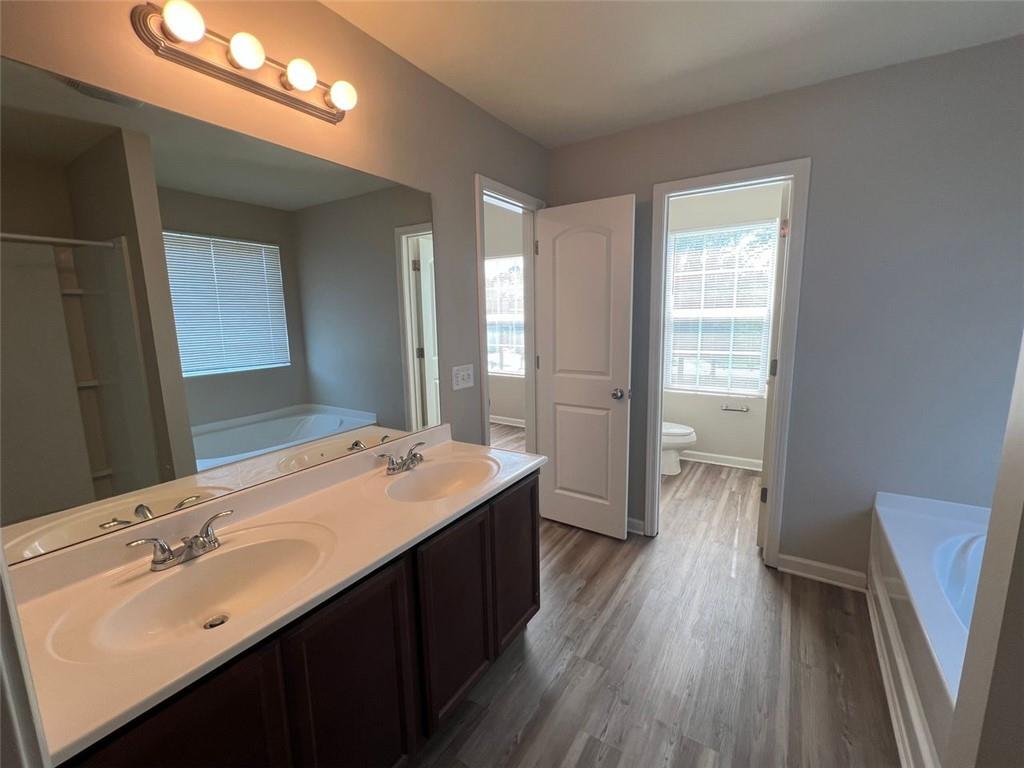 34 Luwanda Trail Cartersville, GA 30120 - Photo 18 of 30 a bathroom with a sink a mirror and a shower