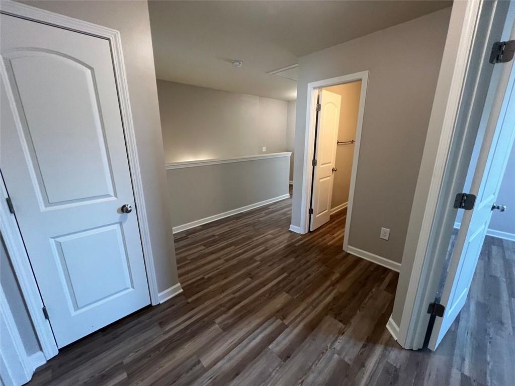 34 Luwanda Trail Cartersville, GA 30120 - Photo 21 of 30 a view of a hallway with wooden floor and staircase