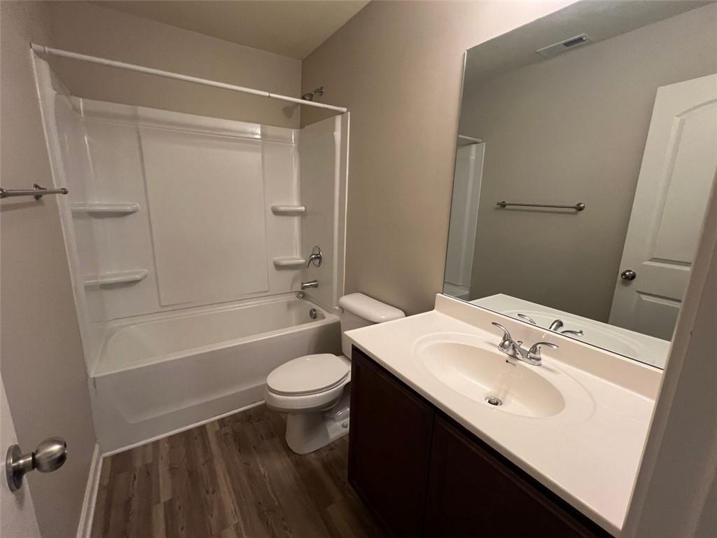 34 Luwanda Trail Cartersville, GA 30120 - Photo 23 of 30 a bathroom with a sink a toilet a mirror and shower