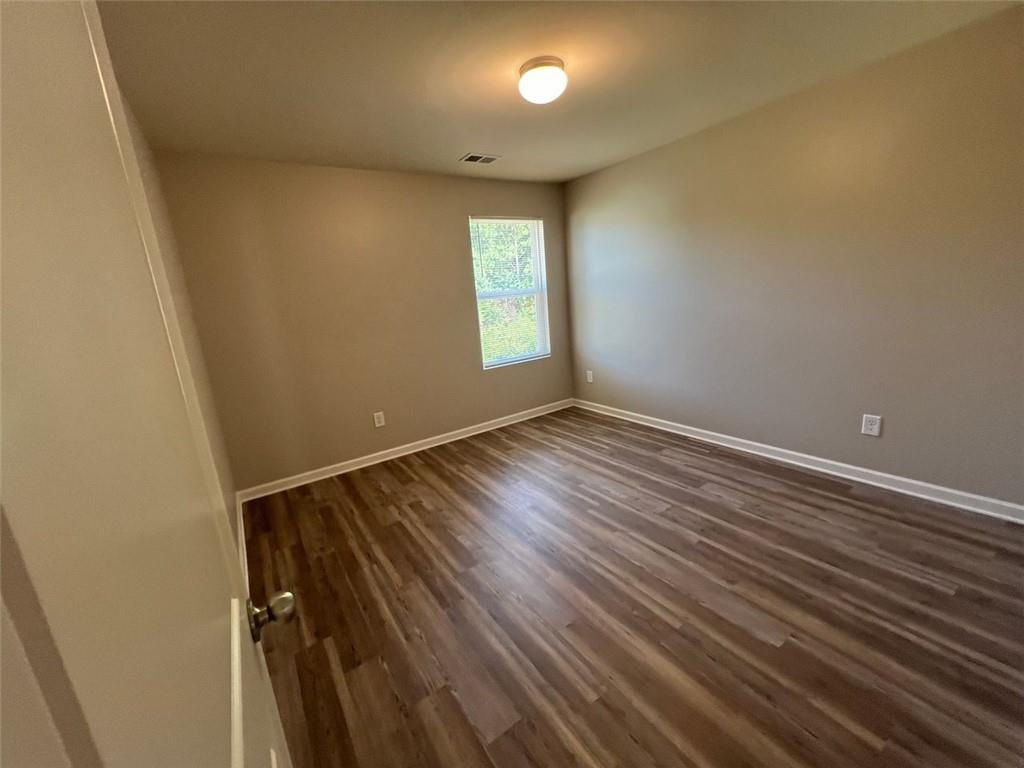 34 Luwanda Trail Cartersville, GA 30120 - Photo 27 of 30 a view of an empty room with wooden floor and a window