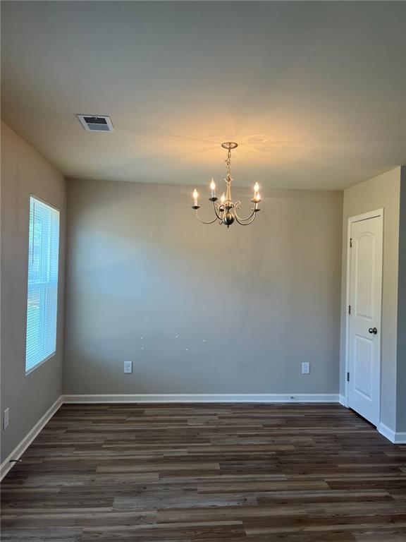 34 Luwanda Trail Cartersville, GA 30120 - Photo 8 of 30 a view of an empty room with wooden floor and a window