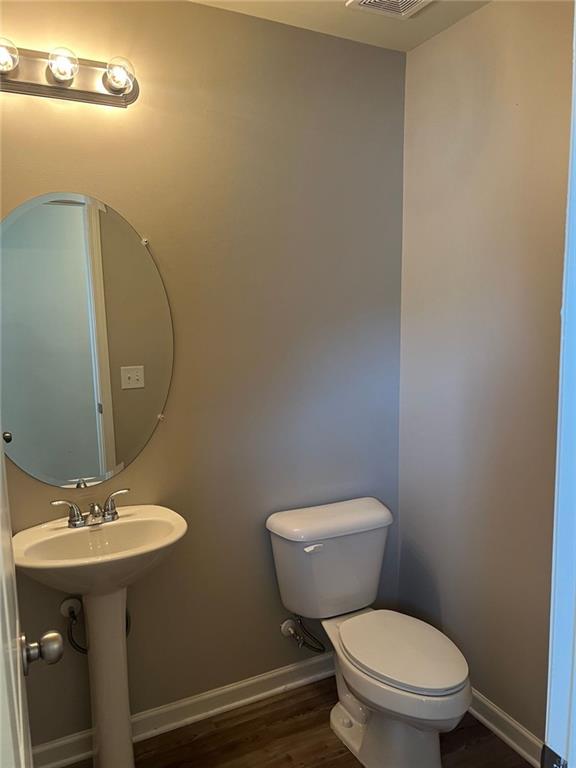 34 Luwanda Trail Cartersville, GA 30120 - Photo 9 of 30 a bathroom with a toilet sink and mirror