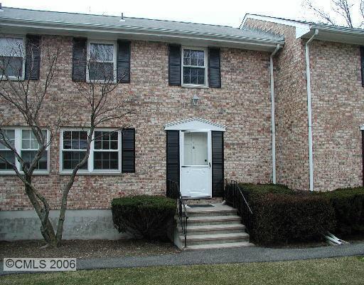 35 Woodway Road, Unit A14 Stamford, CT 06907 - Photo 1 of 1 a front view of a house with stairs