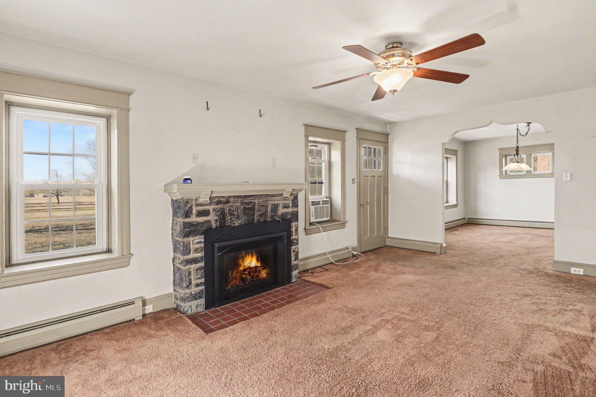 3159 Bristol Road Doylestown, PA 18901 - Photo 14 of 40 an empty room with windows and fireplace