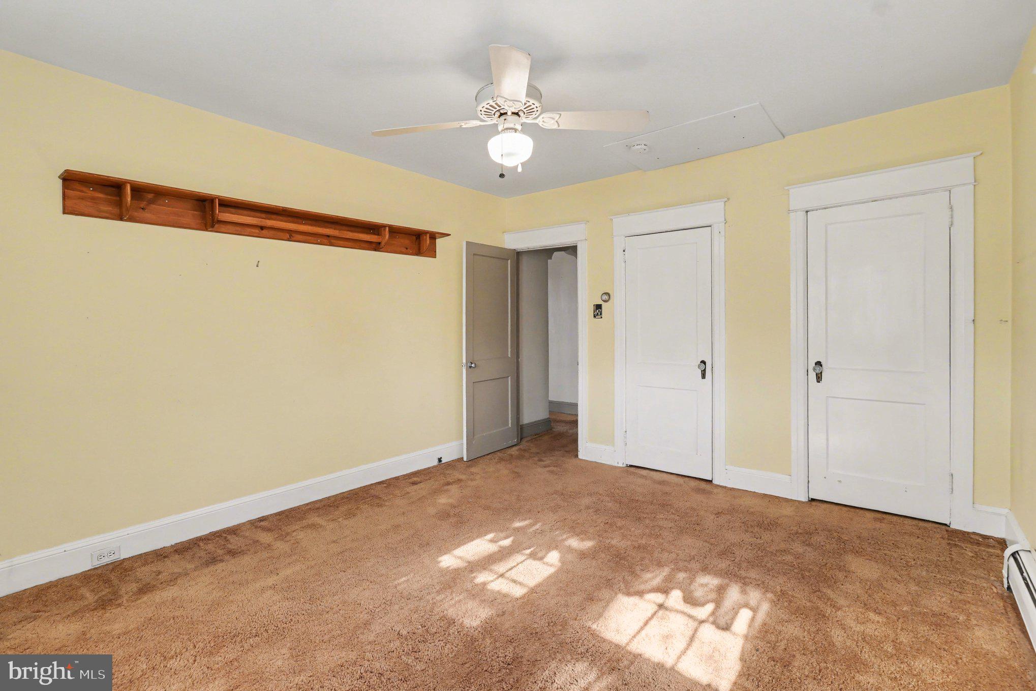 3159 Bristol Road Doylestown, PA 18901 - Photo 16 of 40 a view of a livingroom with a ceiling fan and closet