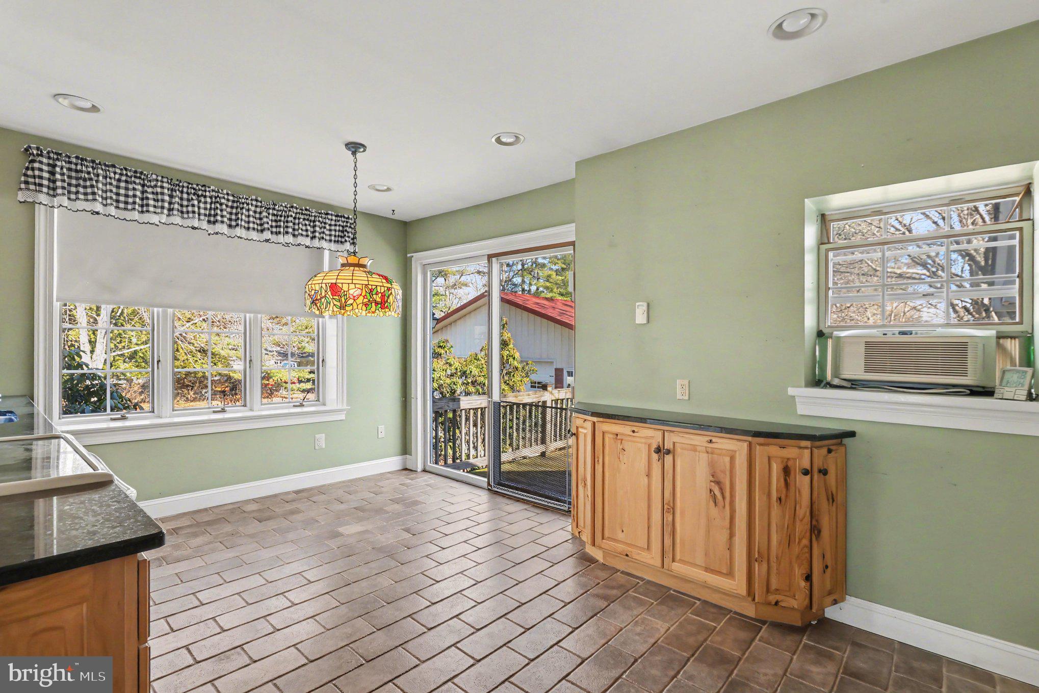 3159 Bristol Road Doylestown, PA 18901 - Photo 5 of 40 a view of an empty room with window and wooden floor