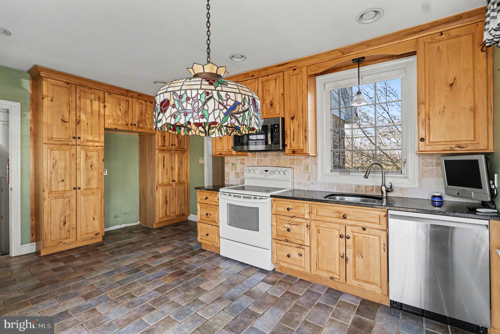 3159 Bristol Road Doylestown, PA 18901 - Photo 7 of 40 a kitchen with a sink stove and refrigerator