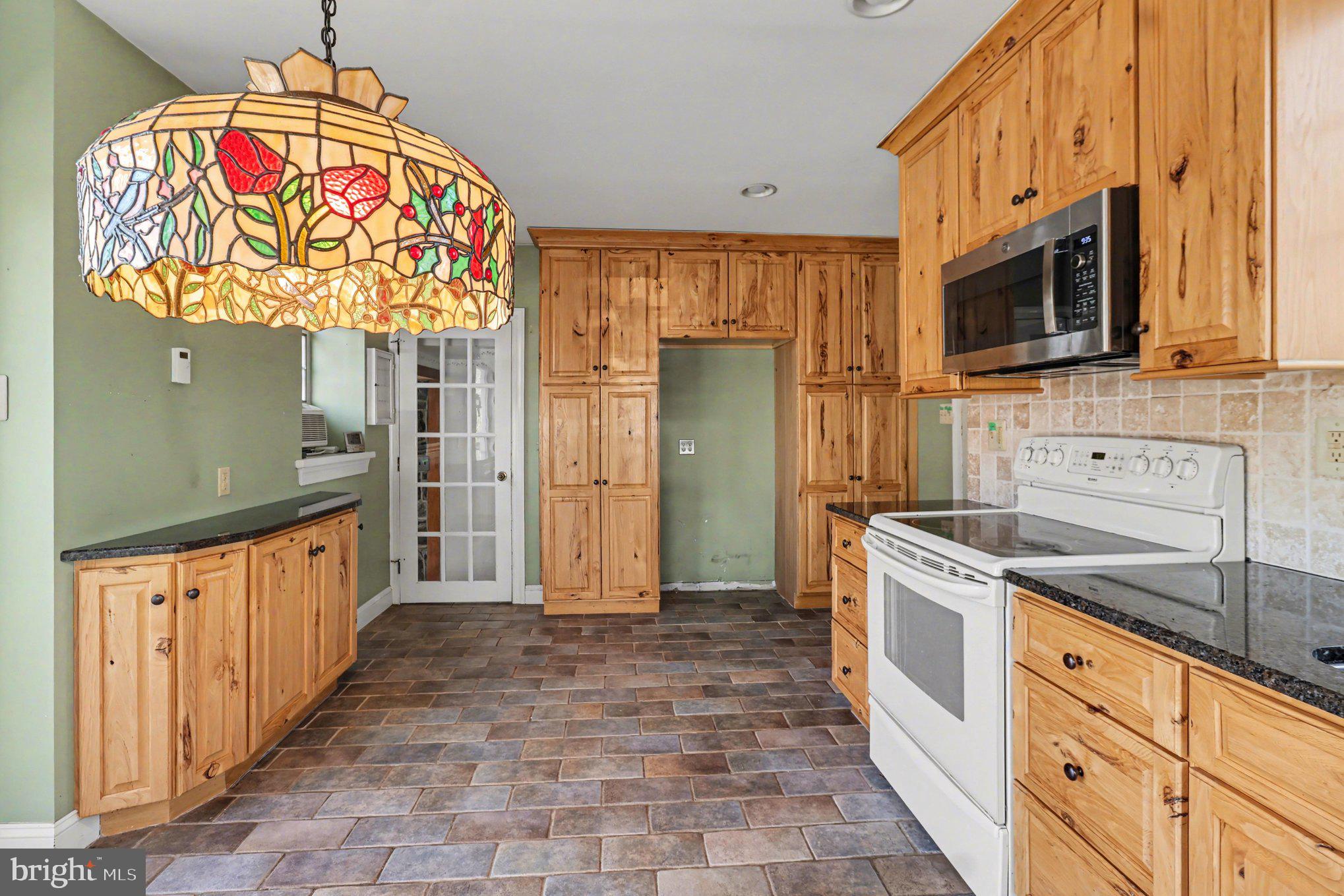 3159 Bristol Road Doylestown, PA 18901 - Photo 8 of 40 a kitchen with stainless steel appliances granite countertop a sink and a stove