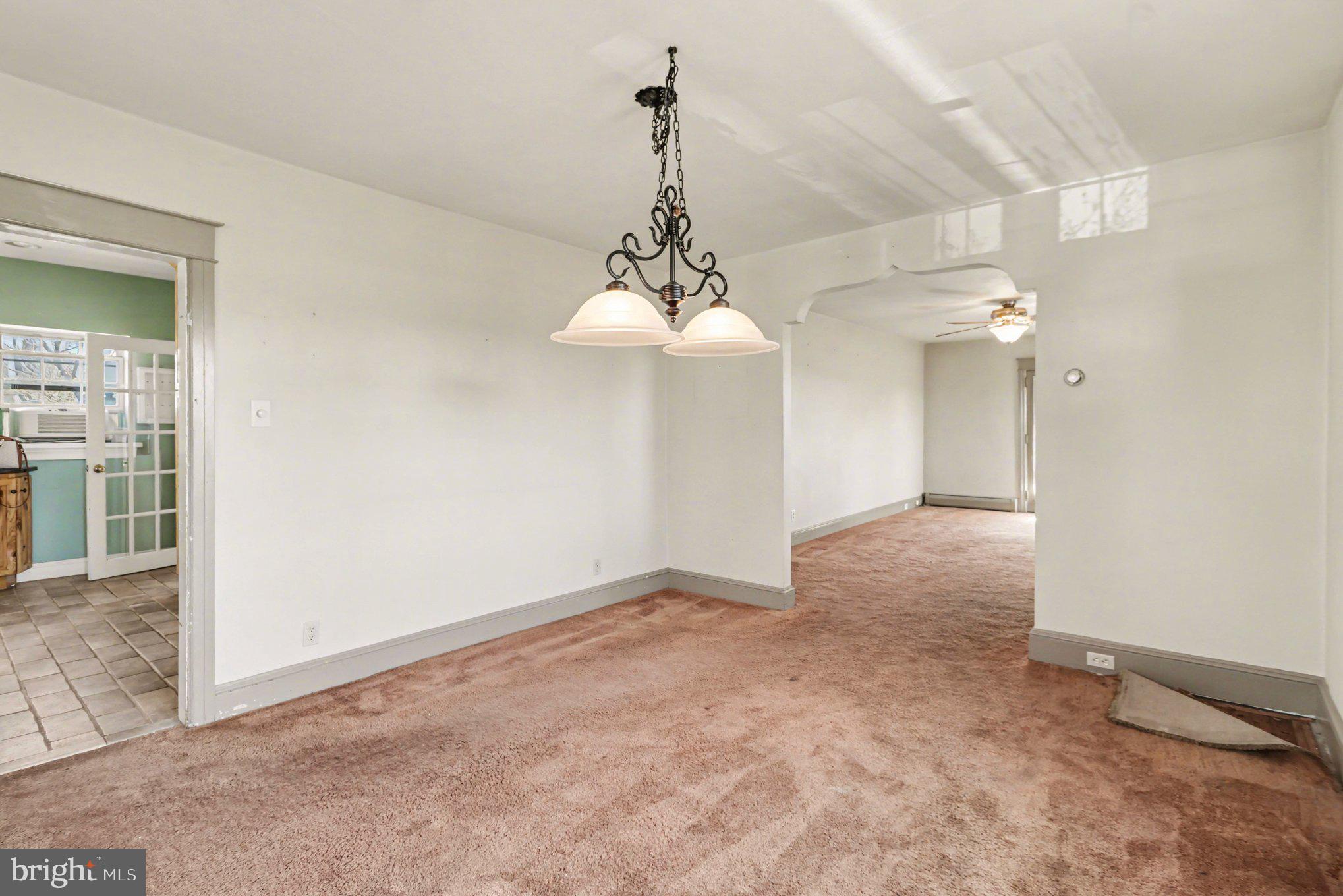 3159 Bristol Road Doylestown, PA 18901 - Photo 10 of 40 a view of a room with a chandelier fan and window