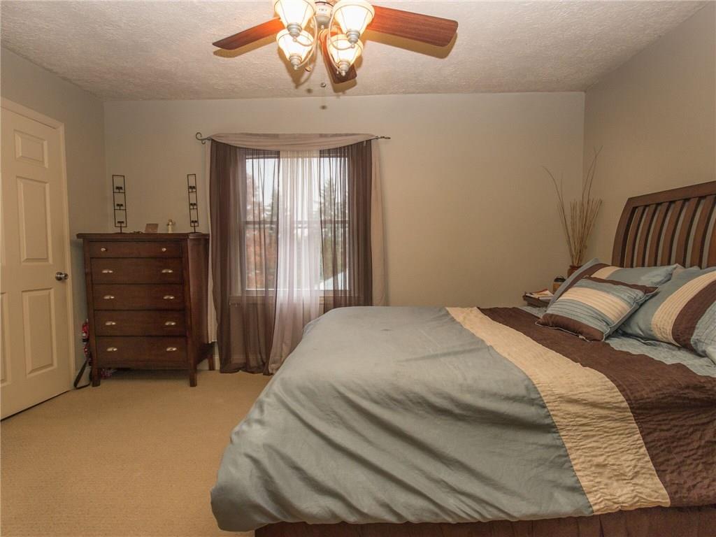 2022 Darlington Road Beaver Falls, PA 15010 - Photo 11 of 20 LOVELY MASTER BEDROOM WITH WALK-IN CLOSET, FAN/LIGHT AND EXTRA STORAGE THROUGH PANEL IN CLOSET