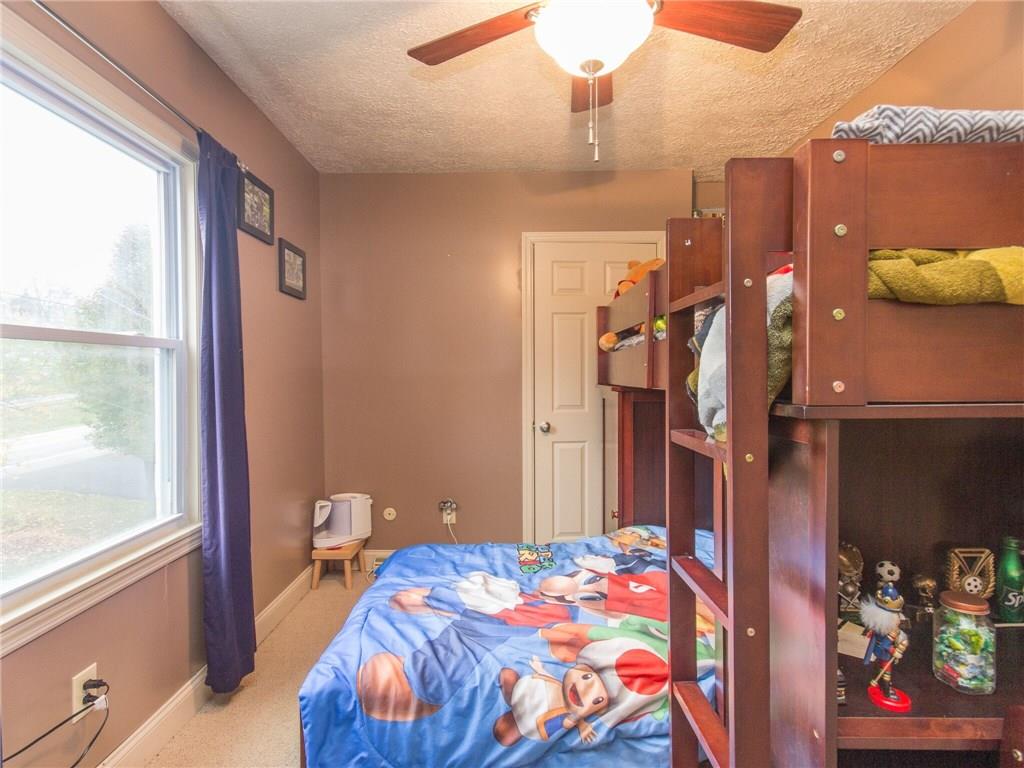 2022 Darlington Road Beaver Falls, PA 15010 - Photo 13 of 20 THIRD BEDROOM HAS CLOSET WITH ATTIC ACCESS AND FAN/LIGHT. THERE ARE PANELS IN THIS ROOM WITH EXTRA STORAGE BEHIND AND A BUILT-IN SHELF UNIT BY CLOSET DOOR