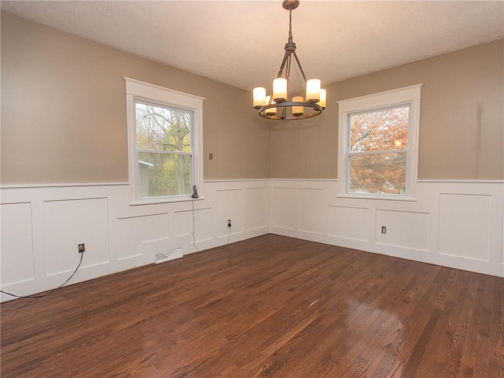 2022 Darlington Road Beaver Falls, PA 15010 - Photo 4 of 20 BEAUTIFUL, OPEN DINING ROOM WITH PANELED CHAIR RAIL AND NEW CHANDELIER. ALL NEW WINDOWS THROUGH OUT HOME!