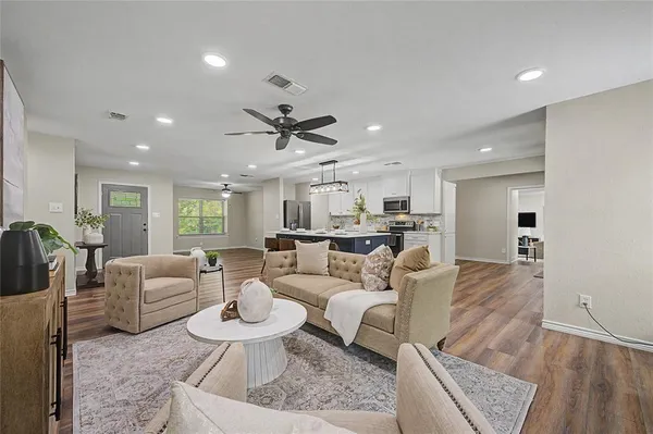 a living room with furniture and a large window