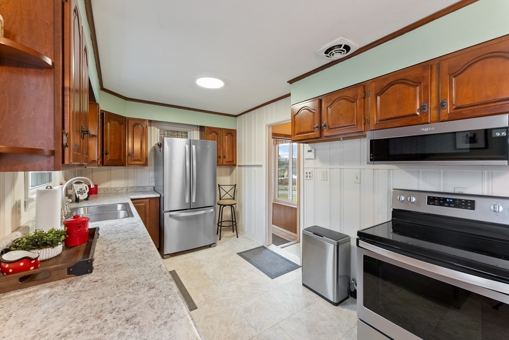 430 Amostown Road West Springfield, MA 01089 - Photo 12 of 41 a kitchen with stainless steel appliances granite countertop a refrigerator and a stove