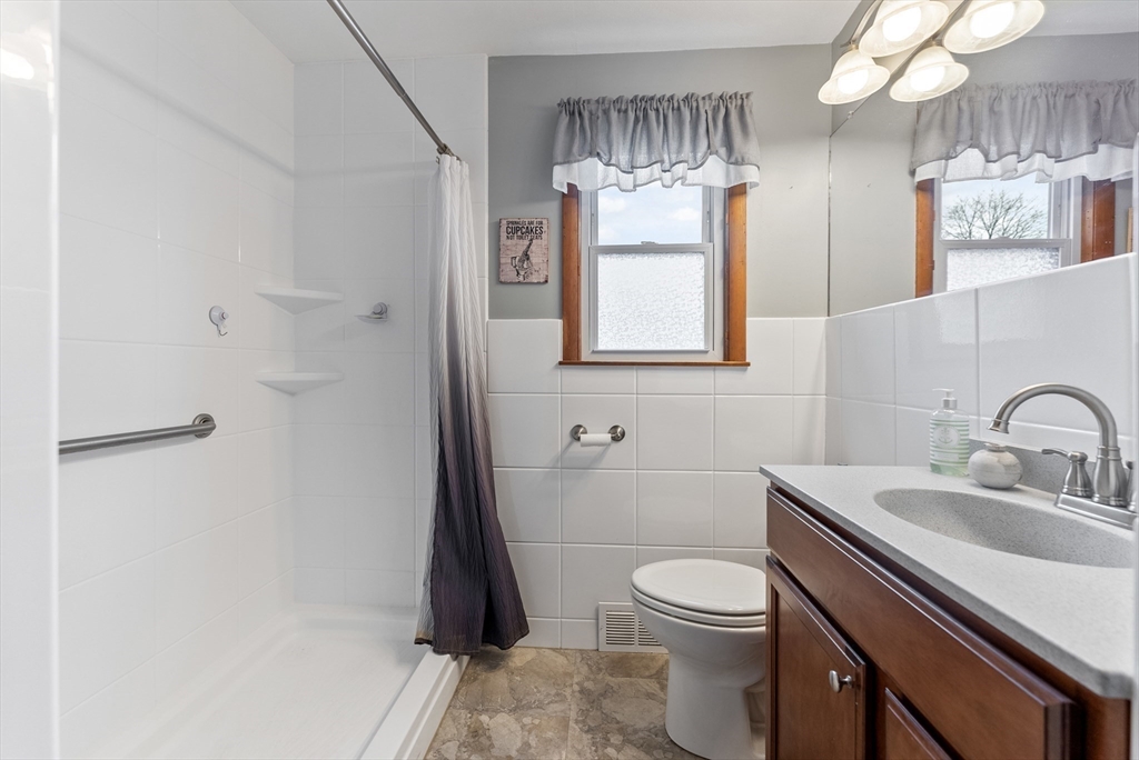 430 Amostown Road West Springfield, MA 01089 - Photo 18 of 41 a bathroom with a sink a toilet and shower
