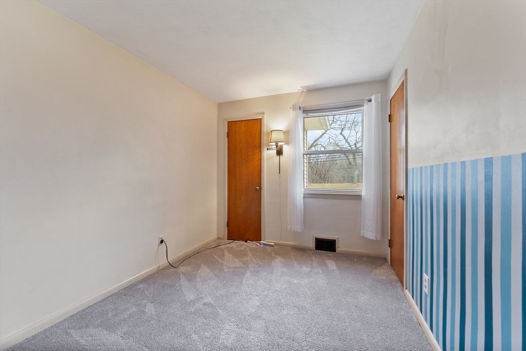 430 Amostown Road West Springfield, MA 01089 - Photo 23 of 41 a view of an empty room with a window