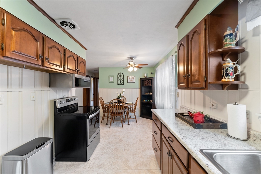 430 Amostown Road West Springfield, MA 01089 - Photo 9 of 41 a kitchen with stainless steel appliances granite countertop a sink dishwasher stove and refrigerator