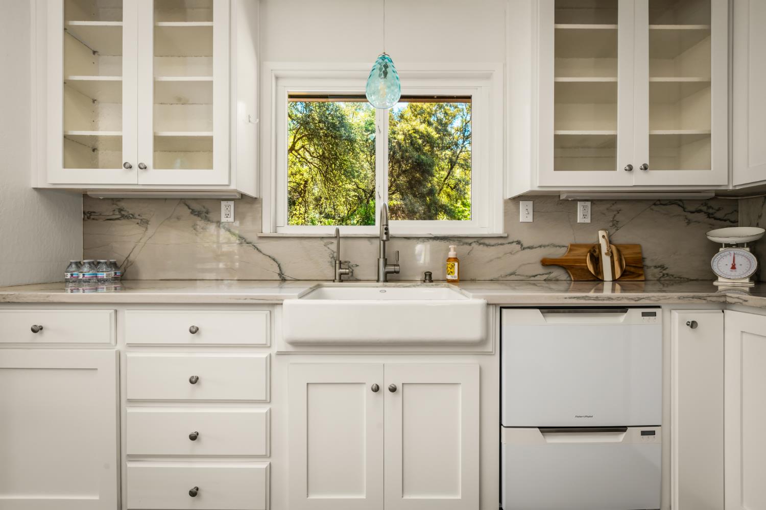 10875 Spenceville Road Penn Valley, CA 95946 - Photo 13 of 49 a kitchen with stainless steel appliances white cabinets and a window