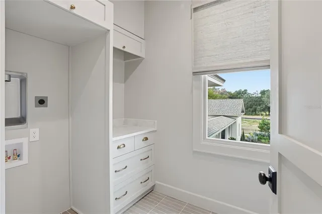a front view of a house with a yard and porch