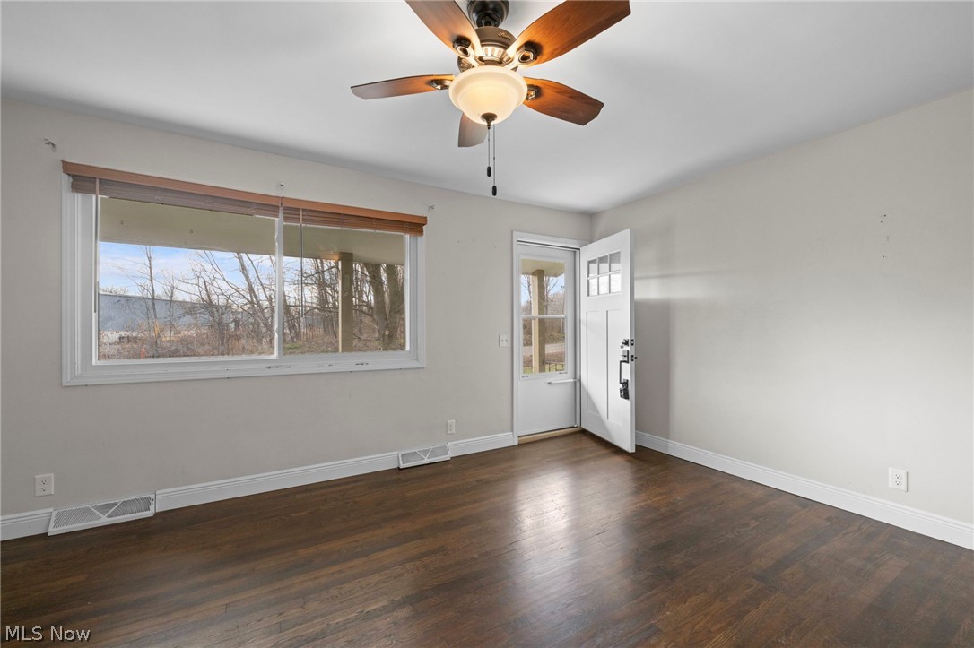 1835 Windham Road Newton Falls, OH 44444 - Photo 5 of 40 Spare room featuring dark wood finished floors and a ceiling fan
