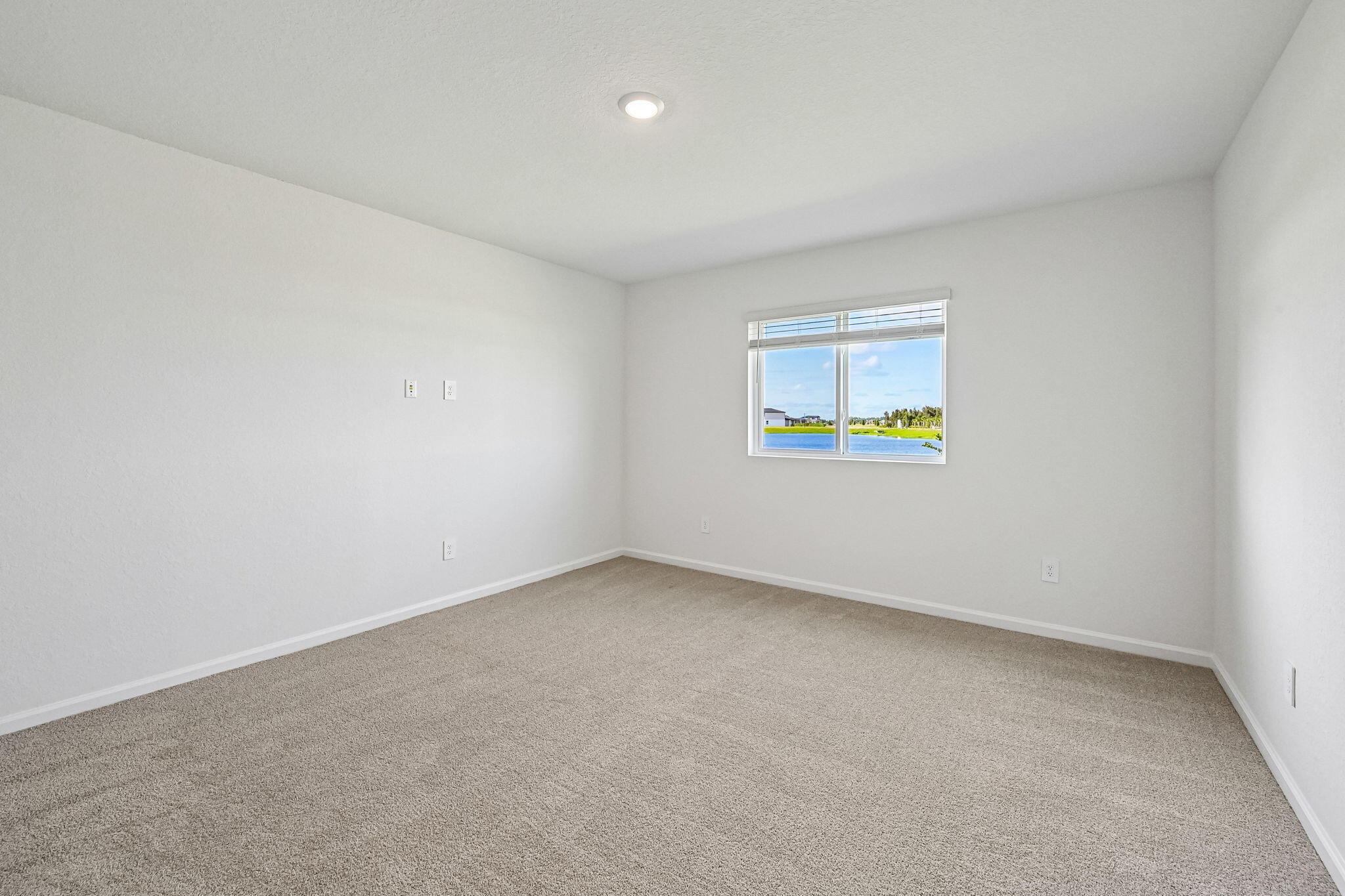 14503 Southwest New Dawn Road Indiantown, FL 34956 - Photo 27 of 42 an empty room with a window