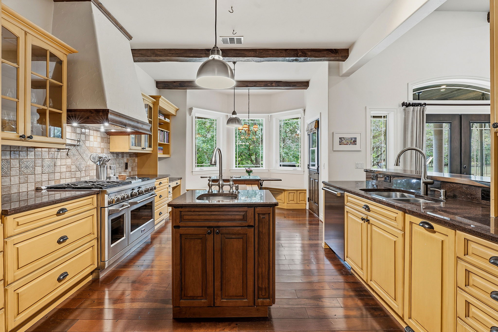 8121 Bluff Trail Austin, TX 78737 - Photo 6 of 40 Heart of the home, this gourmet kitchen offers a large island, double ovens, and ample cabinetry for culinary pursuits.