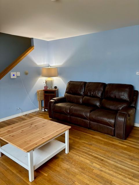 300 Duane Street, Unit 2 Glen Ellyn, IL 60137 - Photo 4 of 6 a bedroom with a bed window and couch