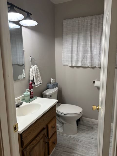 300 Duane Street, Unit 2 Glen Ellyn, IL 60137 - Photo 5 of 6 a bathroom with a sink and a toilet