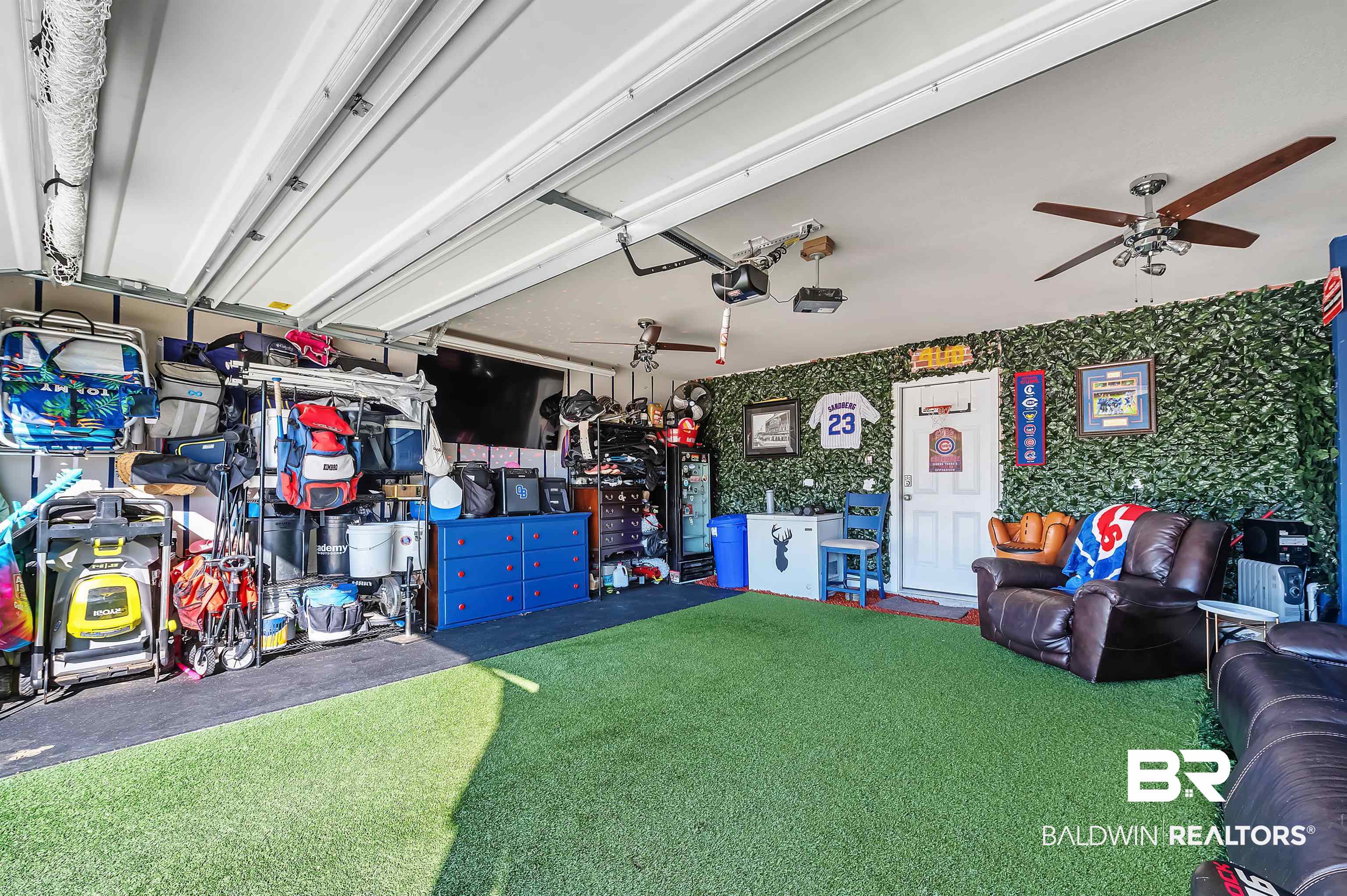 24549 Broken Sound Loop Orange Beach, AL 36561 - Photo 53 of 57 Garage with ceiling fan and a garage door opener