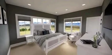 a bed room with a bed and a large window