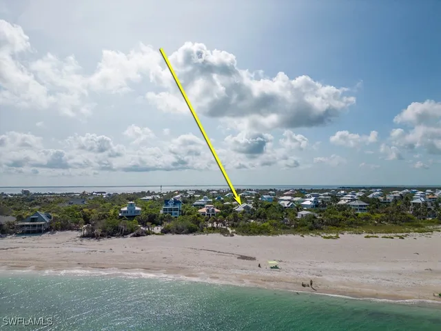 an aerial view of a golf course with a lake view