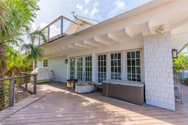 a balcony with furniture and potted plants