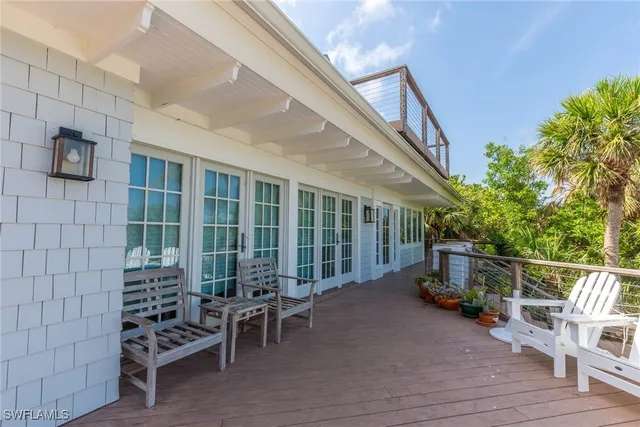 a view of a balcony with a tree