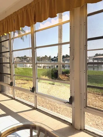 a view of a glass door with a large window