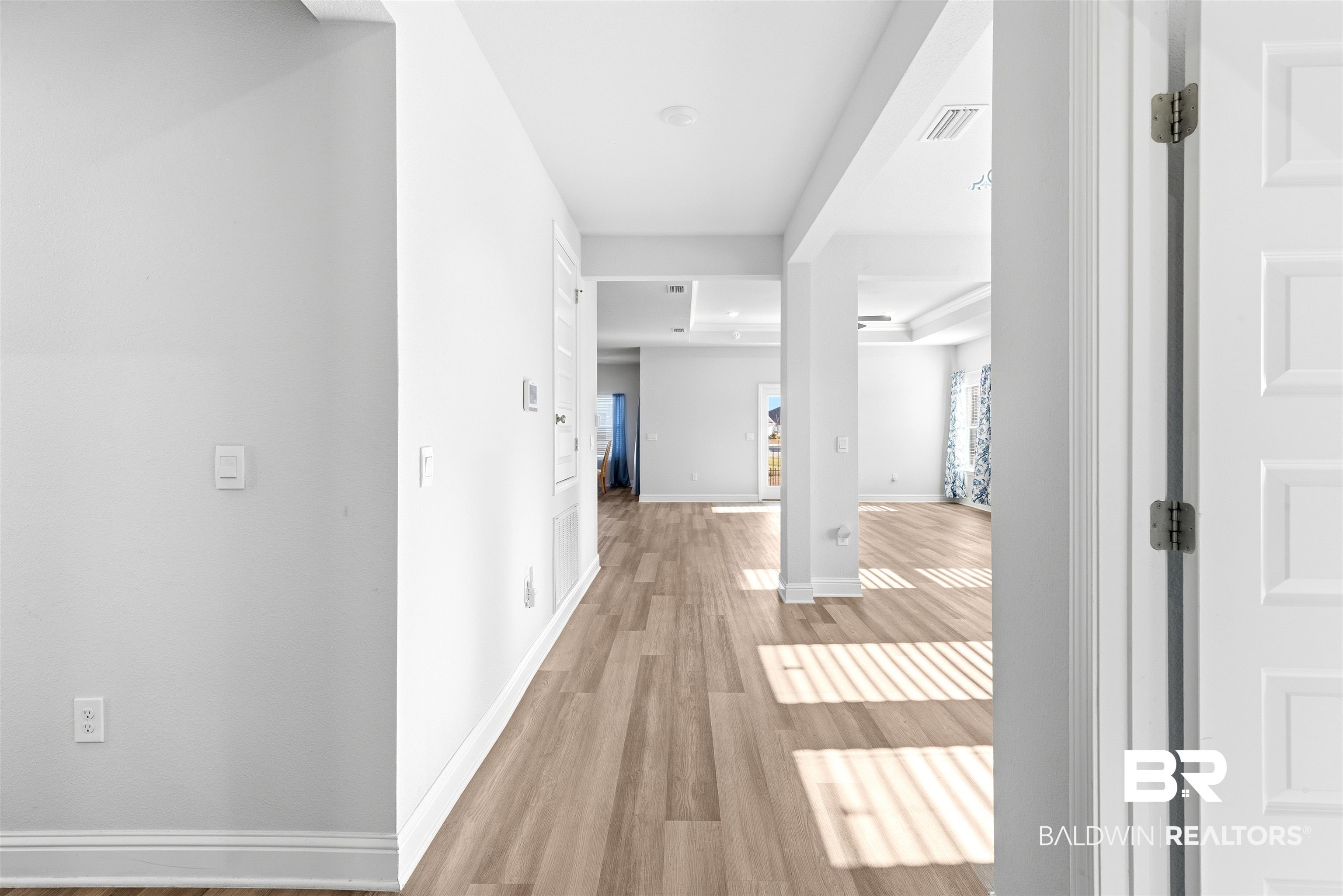 485 Shepard Street Gulf Shores, AL 36542 - Photo 8 of 53 Hallway with light wood-style floors and baseboards