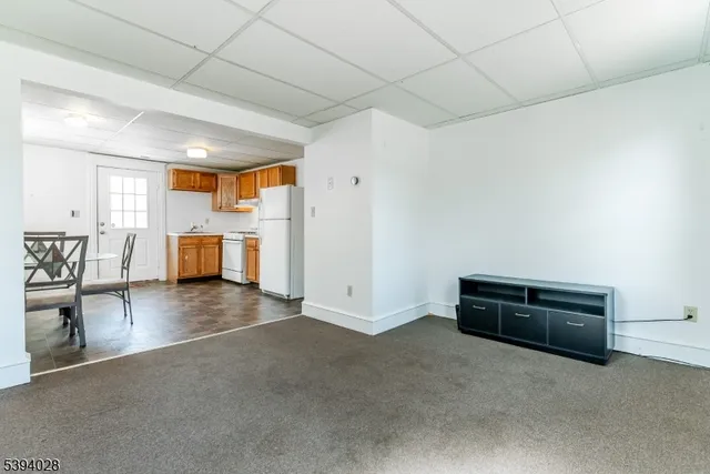 a view of a livingroom with furniture and fire place