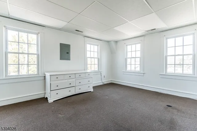 a bathroom with a granite countertop sink a toilet and shower